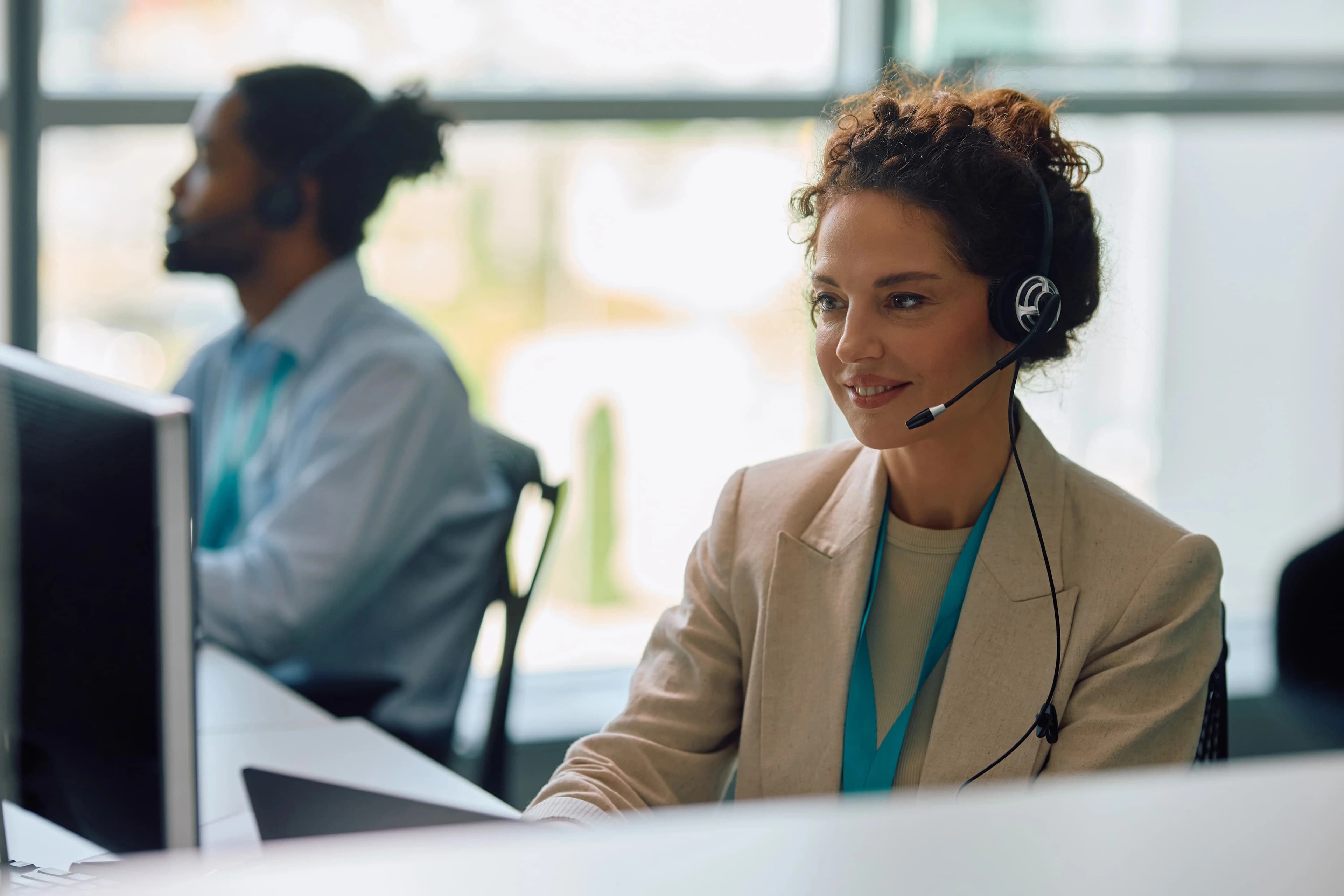 Female Contact Center employee working on her desktop